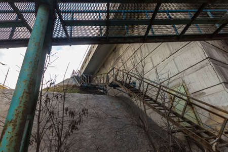 Crossing the rusty iron stairsの写真素材