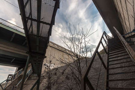 Crossing the rusty iron stairsの写真素材