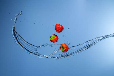 strawberries with water sprayの写真素材