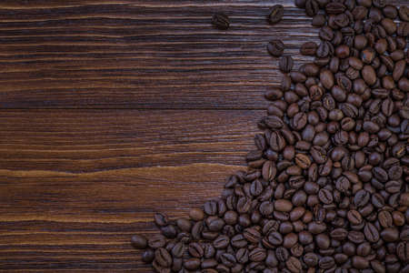 coffee beans on wooden backgroundの写真素材