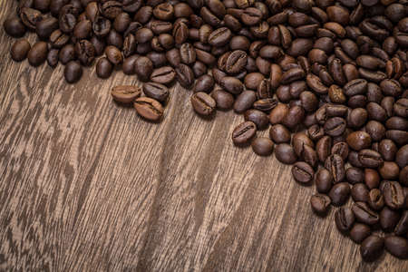 coffee beans on wooden backgroundの写真素材