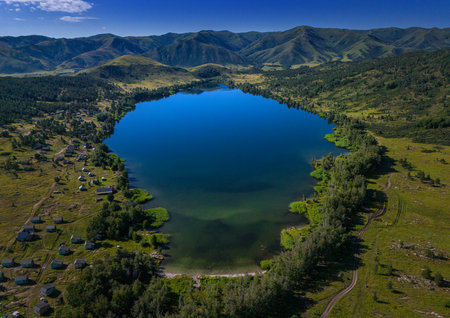 Aerial view of the small lake in the mountains in summer.の写真素材