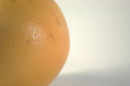 Part of a ripe, juicy, tasty, seductively looking grapefruit. The picture was taken in the lightbox,...