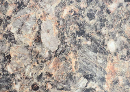 Light gray marble with brown veins and black blotches, close-up of flat surface of natural stone....