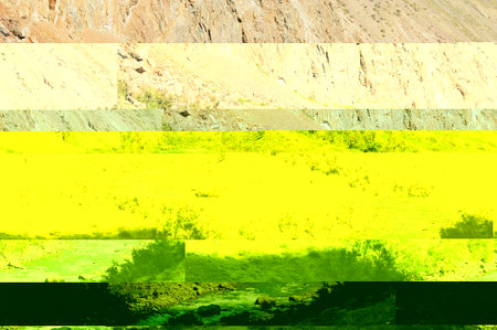 A stormy stream of a swift river in the shadow of the mountains of the setting sun on a warm autumn evening. Chulyshman river, Altai, Siberia, Russia.の写真素材