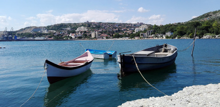Boats along the shallow waters at the shore of the fishing villageのeditorial素材