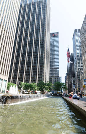 NEW YORK CITY - JULY 12: Undefined people rest near a fountain Avenue of the  Americas on July 12, 2012.のeditorial素材