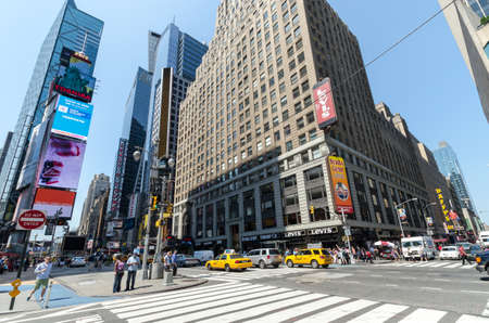 NEW YORK CITY - JULY 12: Undefined people pass through Times Square on July 12, 2012 in New York. Times Square is a major commercial intersection in Manhattan.のeditorial素材