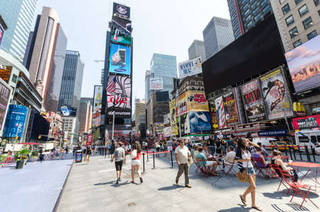 NEW YORK CITY - JULY 12: Undefined people pass through Times Square on July 12, 2012 in New York. Times Square is a major commercial intersection in Manhattan.のeditorial素材
