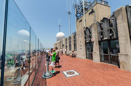 NEW YORK CITY - JULY 12: People look at Manhattan from Rockefeller Center Observation Deck on July...