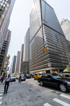 NEW YORK CITY - JULY 12: People walk down sixth avenue on July 12, 2012 in New York. Sixth avenue is a major thoroughfare in New York cityのeditorial素材