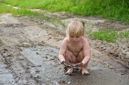 Playing in the mudの写真素材