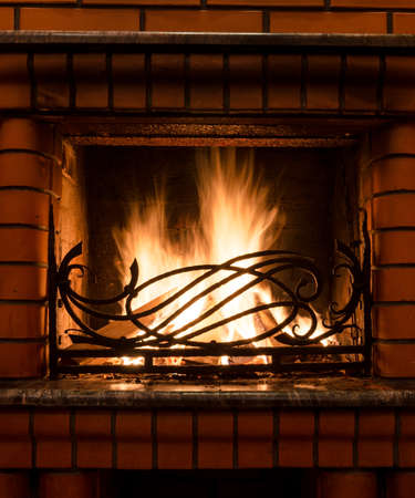 fireplace with iron grateの写真素材