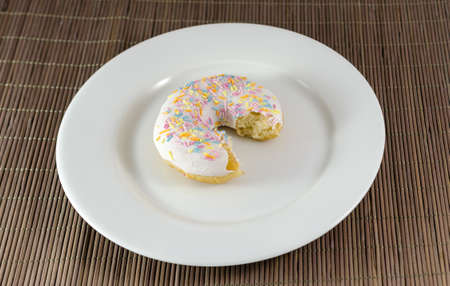 Donut with chunk bitten offの写真素材