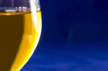 White wine, blue backgroundの写真素材