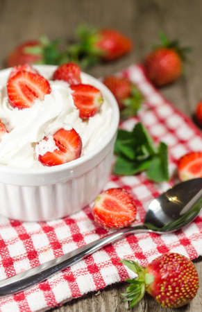 Strawberries with whipped creamの写真素材