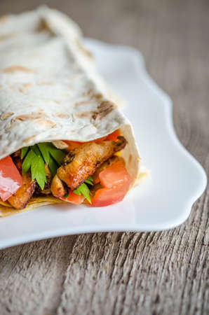 Tortilla with meat and vegetablesの写真素材