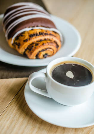 cup of coffee and chocolate bunの写真素材