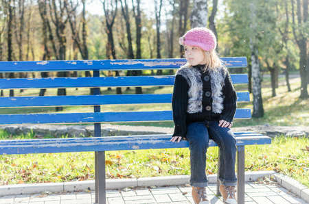 Girl on the benchの写真素材