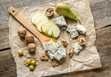 Blue cheese with pears and nutsの写真素材