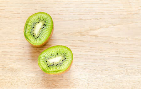 kiwi fruits on wooden tableの写真素材
