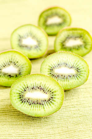 kiwi fruits on wooden tableの写真素材