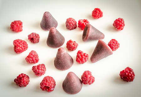cuberdon candies with raspberries