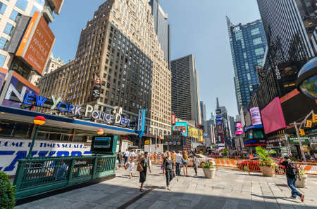NEW YORK CITY - JULY 22: Undefined people pass through Times Square on July 22, 2014 in New York....