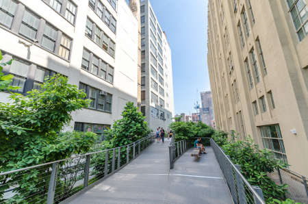 NEW YORK CITY - JULY 22: People walk along the High Line Park on July 22, 2014. The High Line is a...