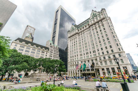 NEW YORK CITY - JUL 17: Grand Army Plaza in New York on July 17, 2014. Grand Army Plaza lies at the intersection of Central Park South and Fifth Avenue in front of the Plaza Hotel in Manhattan.のeditorial素材