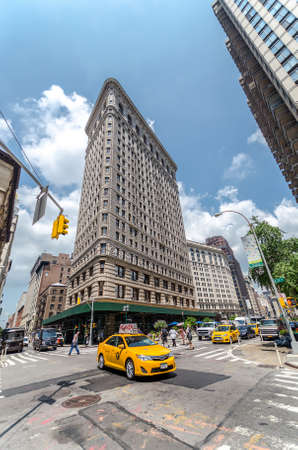 NEW YORK CITY - JUL 22: Flatiron Building in NYC as seen on July 22, 2014 in New York. This iconic...