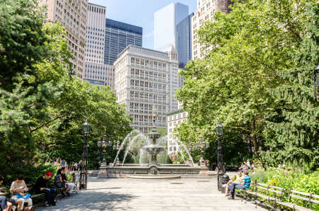 NEW YORK - JUL 17: City Hall Park on July 17, 2014 in New York City. This 8.8-acre downtown park is home to more than a dozen monuments.のeditorial素材