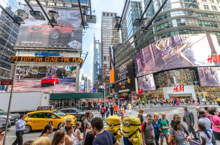NEW YORK - JUL 22: 42nd Street near Times Square with traffic and commercials on July 22, 2014 in New York. 42nd Street is a major crosstown street known for its theaters and landmark architectures.のeditorial素材