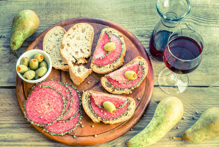 Italian salami with pears and wineの写真素材