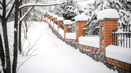fence under snowの写真素材