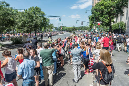 NEW YORK - JULY 10: Thousands of fans cheer as the World Cup-winning US women's soccer team make their way up the The Canyon of Heroes along Broadway during the parade on July 10, 2015 in NYC.のeditorial素材