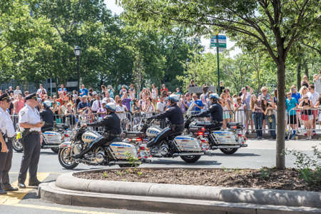 NEW YORK - JULY 10: Police officers drive motorcycles during the  parade on July 10, 2015 in NYC. The parade has been organized to celebrate the U.S. women's soccer team's World Cup final win.のeditorial素材