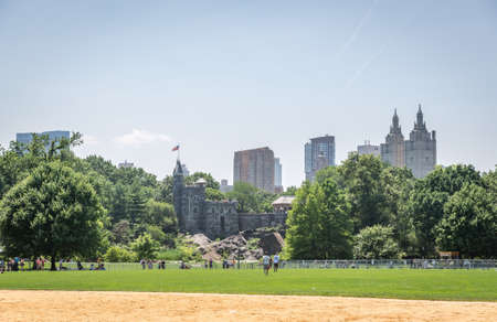 NEW YORK CITY - JULY 10: People have rest in Central Park near the Belvedere Castle on July 10, 2015 in New York. Central Park is an urban park in the central part of the borough of Manhattan.のeditorial素材