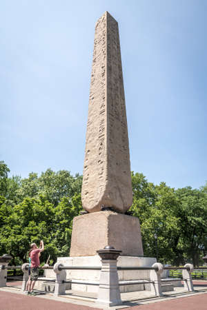 NEW YORK CITY - JULY 10: People take pictures of Obelisk in Central Park on July 10, 2015 in New York. Central Park is an urban park in the central part of the borough of Manhattan.のeditorial素材