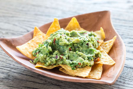 Guacamole with tortilla chipsの写真素材