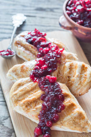 Grilled chicken with cranberry sauceの写真素材