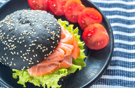 Black sandwich with salmon and cream cheeseの写真素材