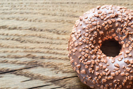 Chocolate donut on the wooden backgroundの写真素材