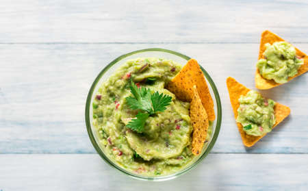 Bowl of guacamole with tortilla chipsの写真素材