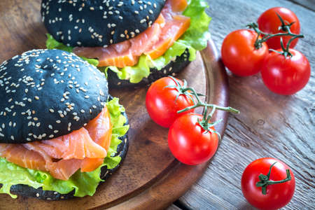 Black sandwich with salmon and cream cheeseの写真素材