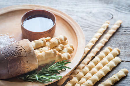 Rosemary breadsticks with ingredientsの写真素材