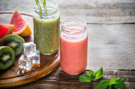 Glass jars of fruit  smoothiesの写真素材