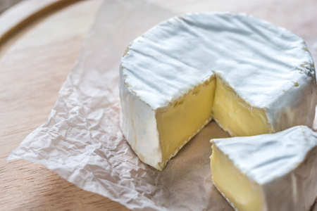 Camembert cheese on the wooden boardの写真素材