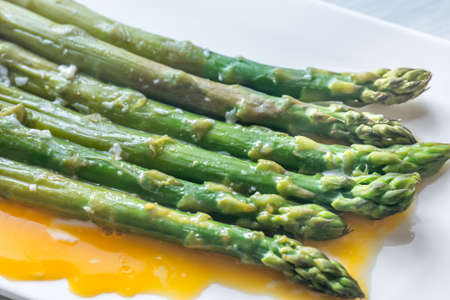 Steamed asparagus with eggs on the plateの写真素材