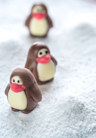 Chocolate candies in the shape of penguinsの写真素材